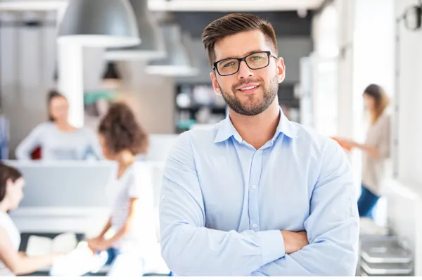 Professional clinic owner confidently leading their team in a modern office
